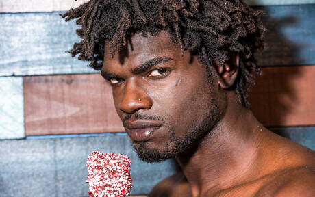 Ebony beefy Devin Trez shows a muscle body